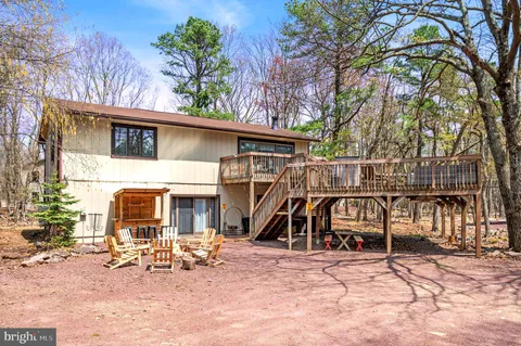 a view of a house with a patio and a slide