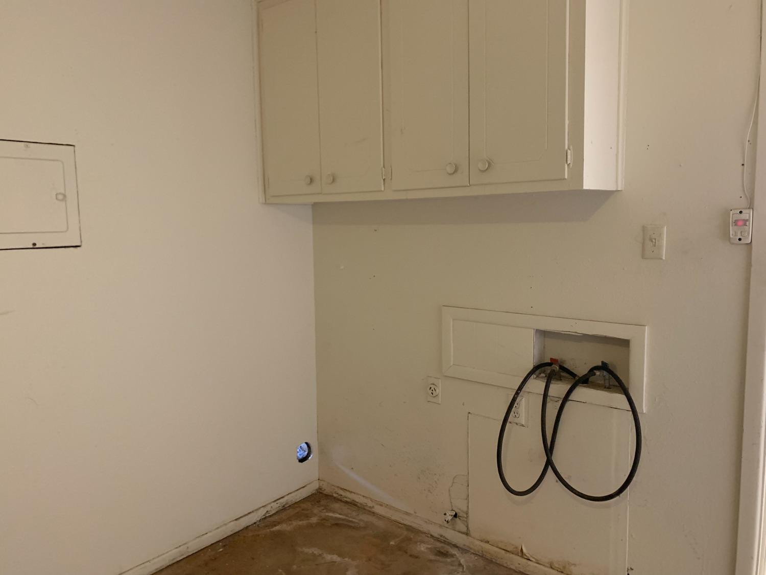 4316 58th Street, Unit B Lubbock, TX 79413 - Photo 14 of 30 a bathroom with a sink and a shower curtain