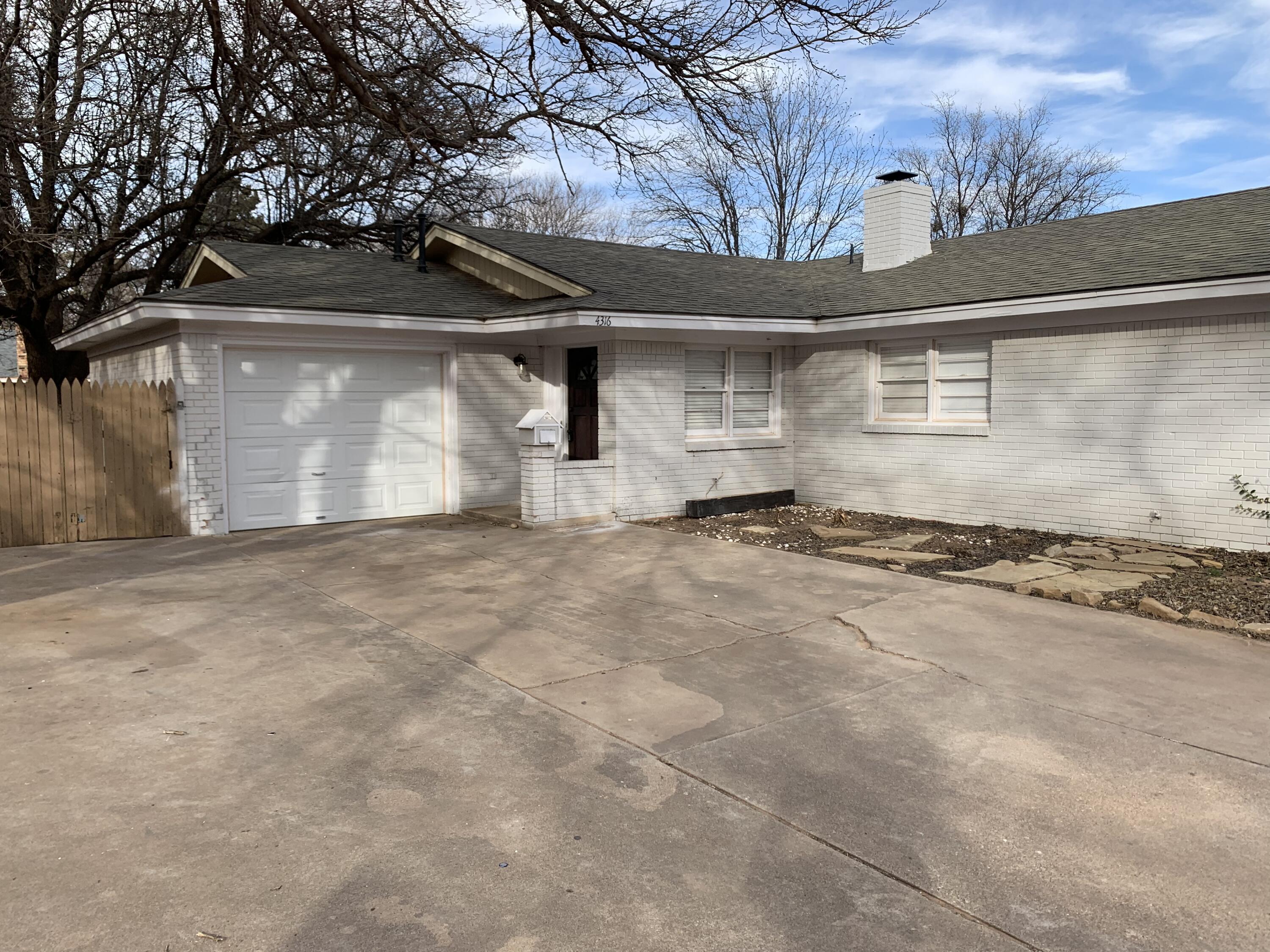 4316 58th Street, Unit B Lubbock, TX 79413 - Photo 16 of 30 a view of a house with a snow