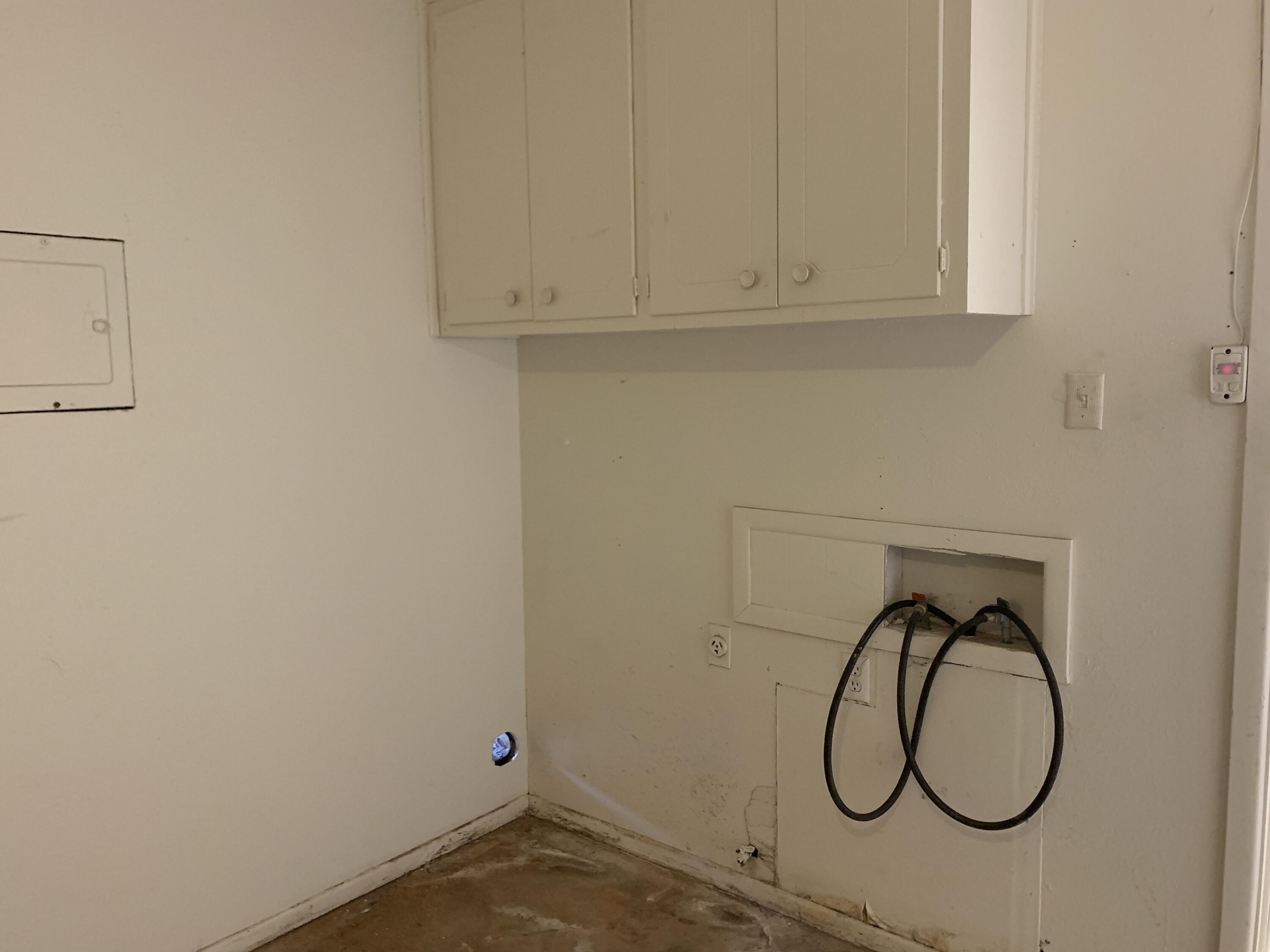 4316 58th Street, Unit B Lubbock, TX 79413 - Photo 29 of 30 a bathroom with a sink and a shower curtain with a window