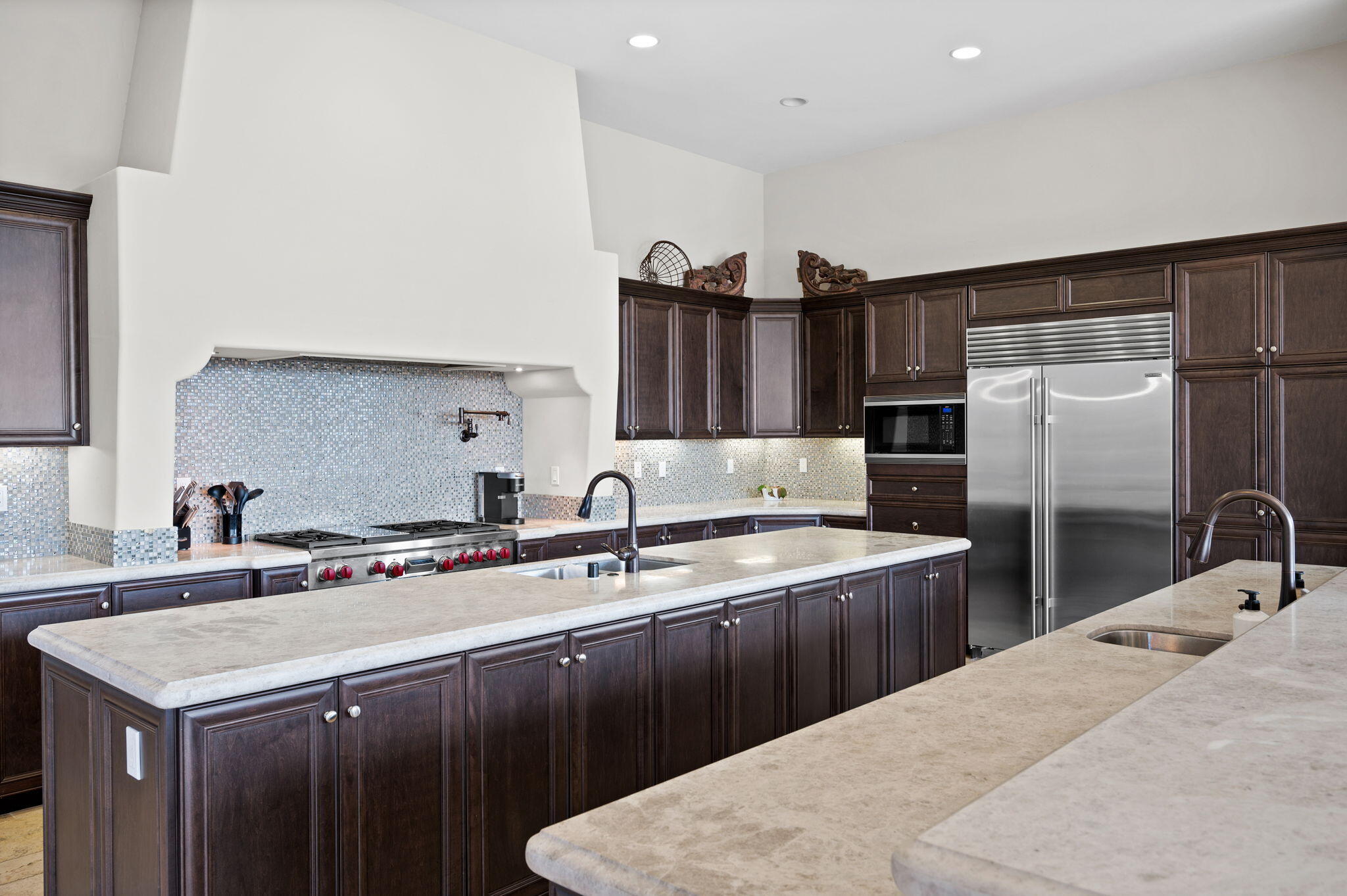 54360 Alysheba Drive La Quinta, CA 92253 - Photo 19 of 68 a kitchen with stainless steel appliances granite countertop a sink a stove and refrigerator
