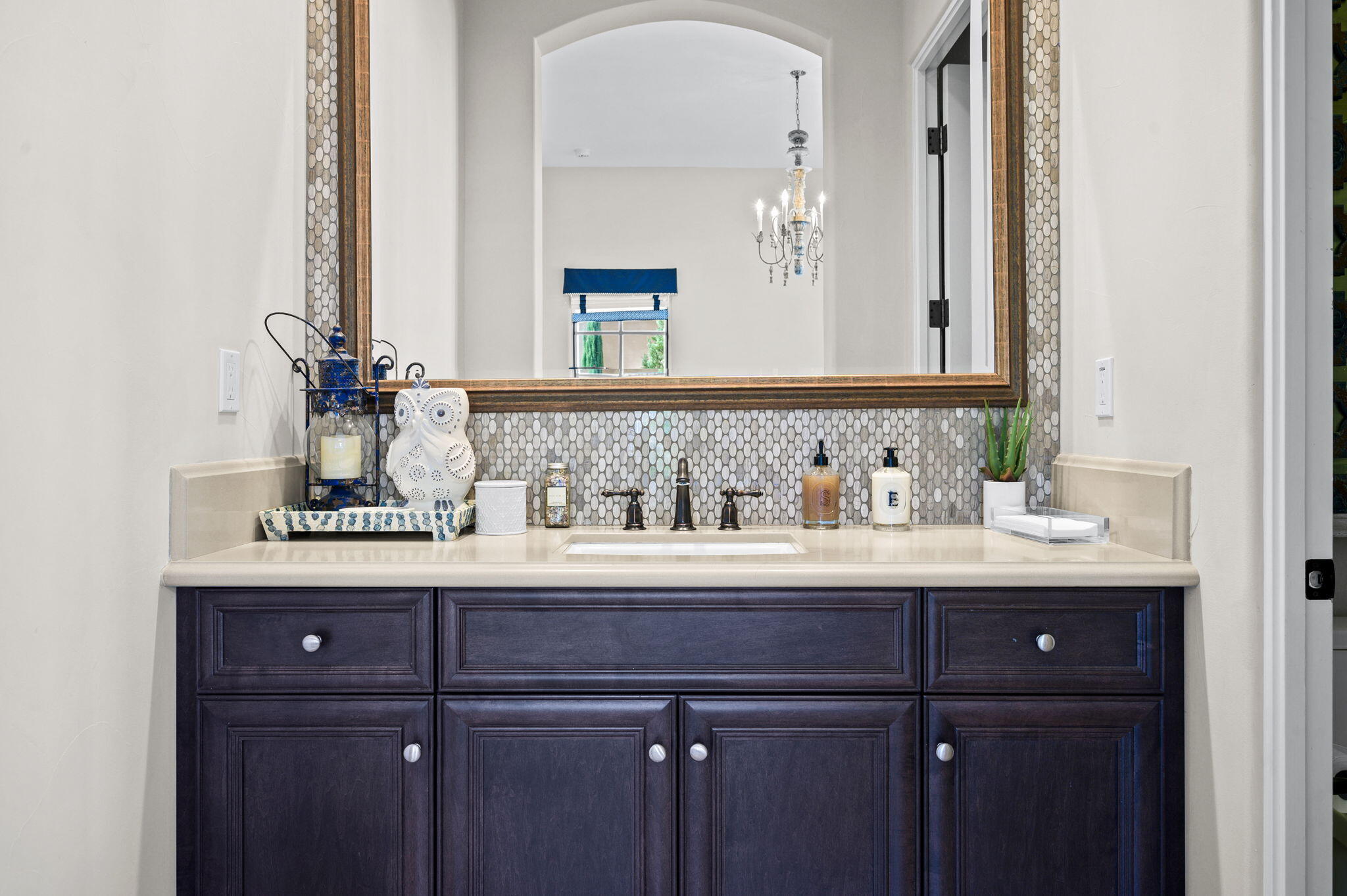 54360 Alysheba Drive La Quinta, CA 92253 - Photo 38 of 68 a bathroom with a sink and a mirror