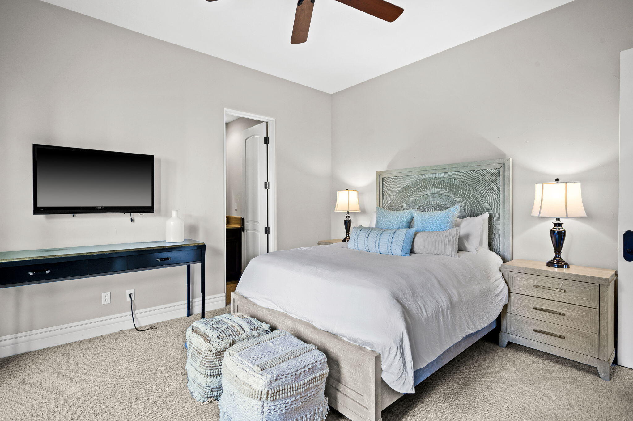 54360 Alysheba Drive La Quinta, CA 92253 - Photo 40 of 68 a bedroom with a bed and a flat tv screen on dresser