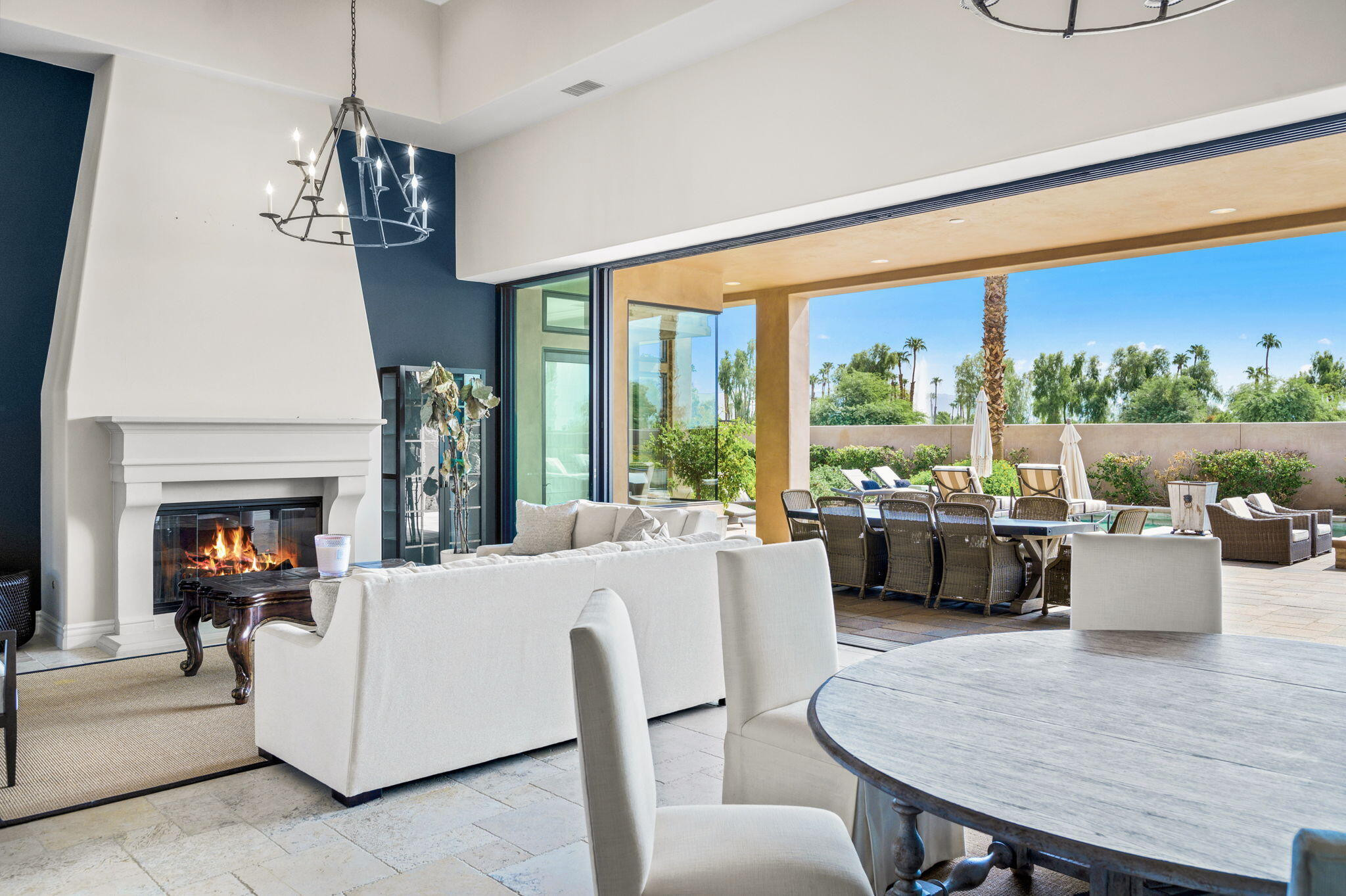 54360 Alysheba Drive La Quinta, CA 92253 - Photo 4 of 68 a living room with furniture a fireplace and a large window