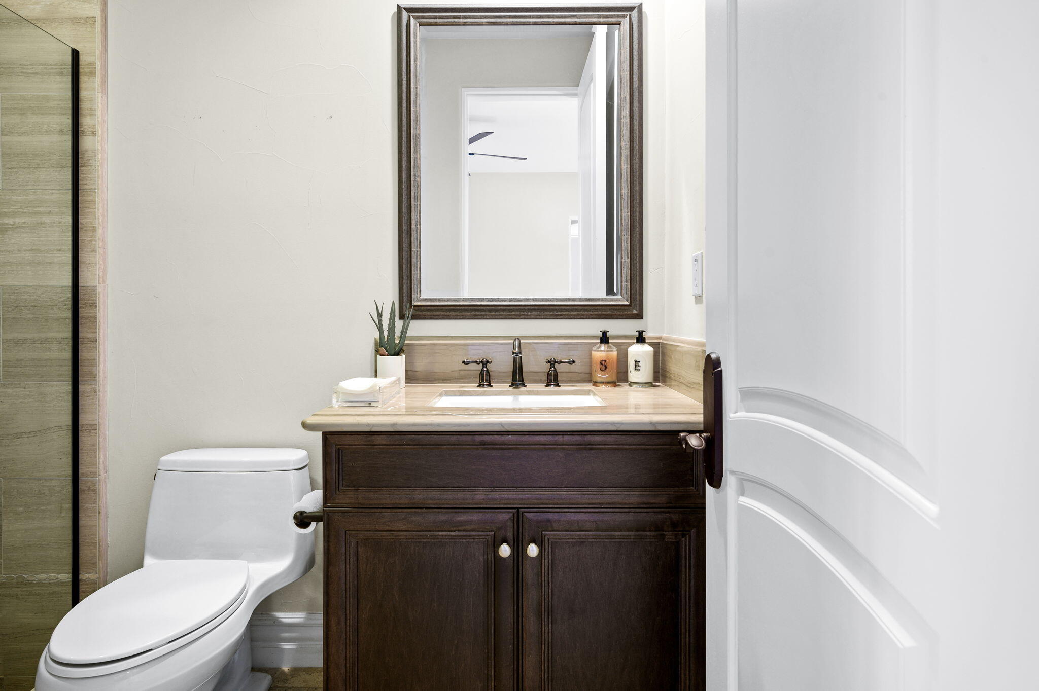 54360 Alysheba Drive La Quinta, CA 92253 - Photo 41 of 68 a bathroom with a sink vanity mirror and toilet
