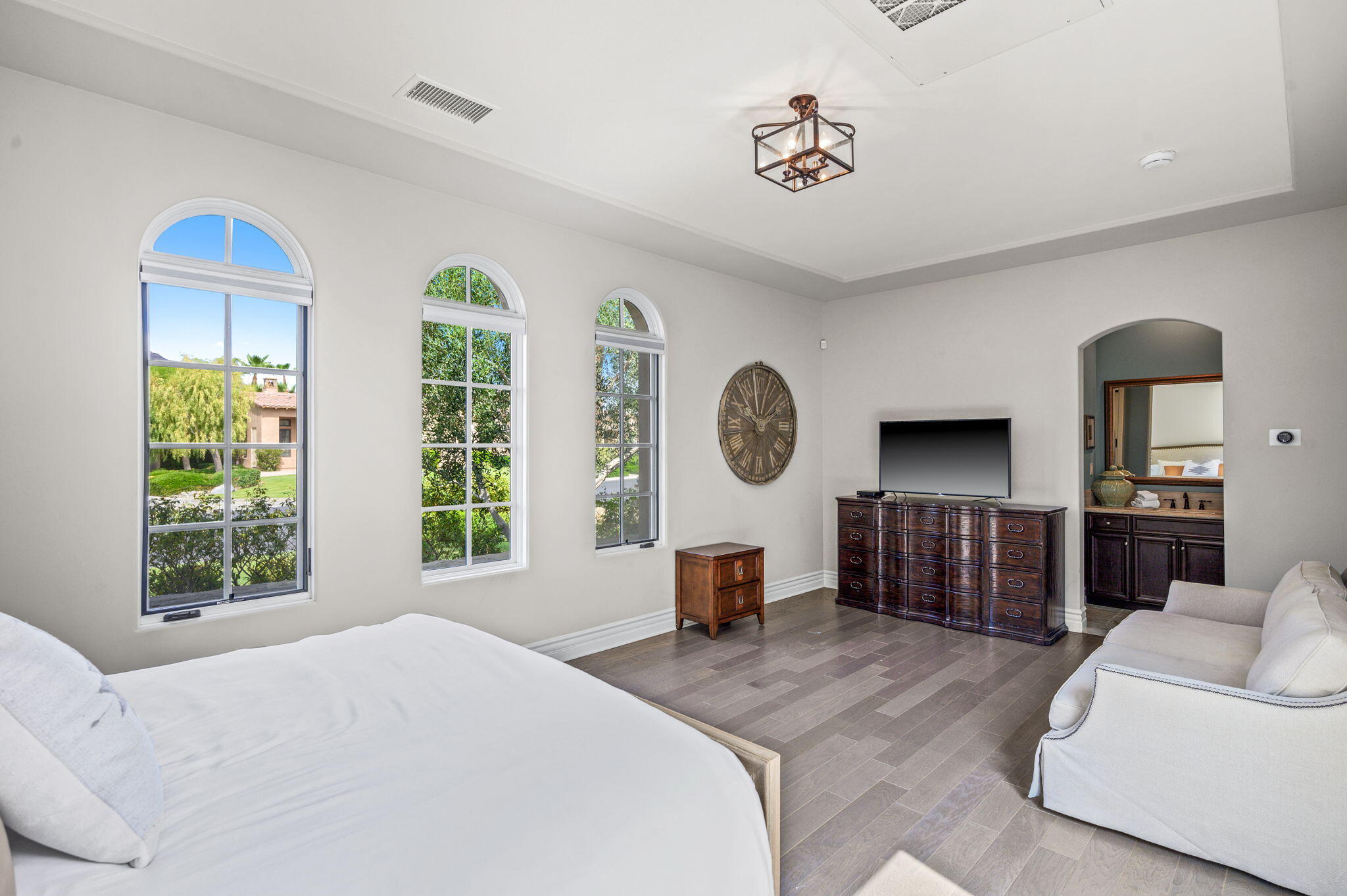 54360 Alysheba Drive La Quinta, CA 92253 - Photo 45 of 68 a bedroom with a large bed and a large window