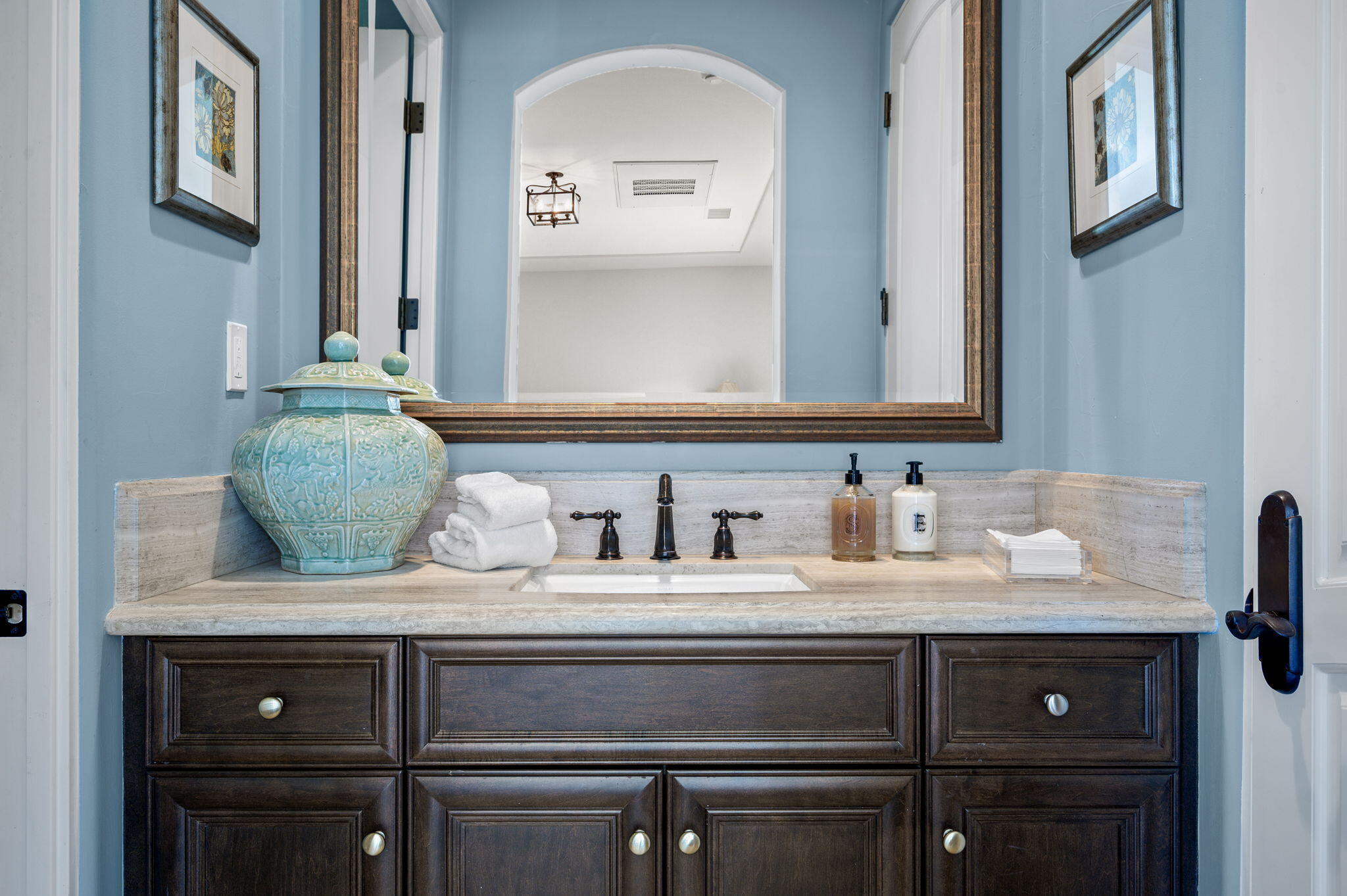 54360 Alysheba Drive La Quinta, CA 92253 - Photo 47 of 68 a bathroom with a granite countertop sink and a mirror