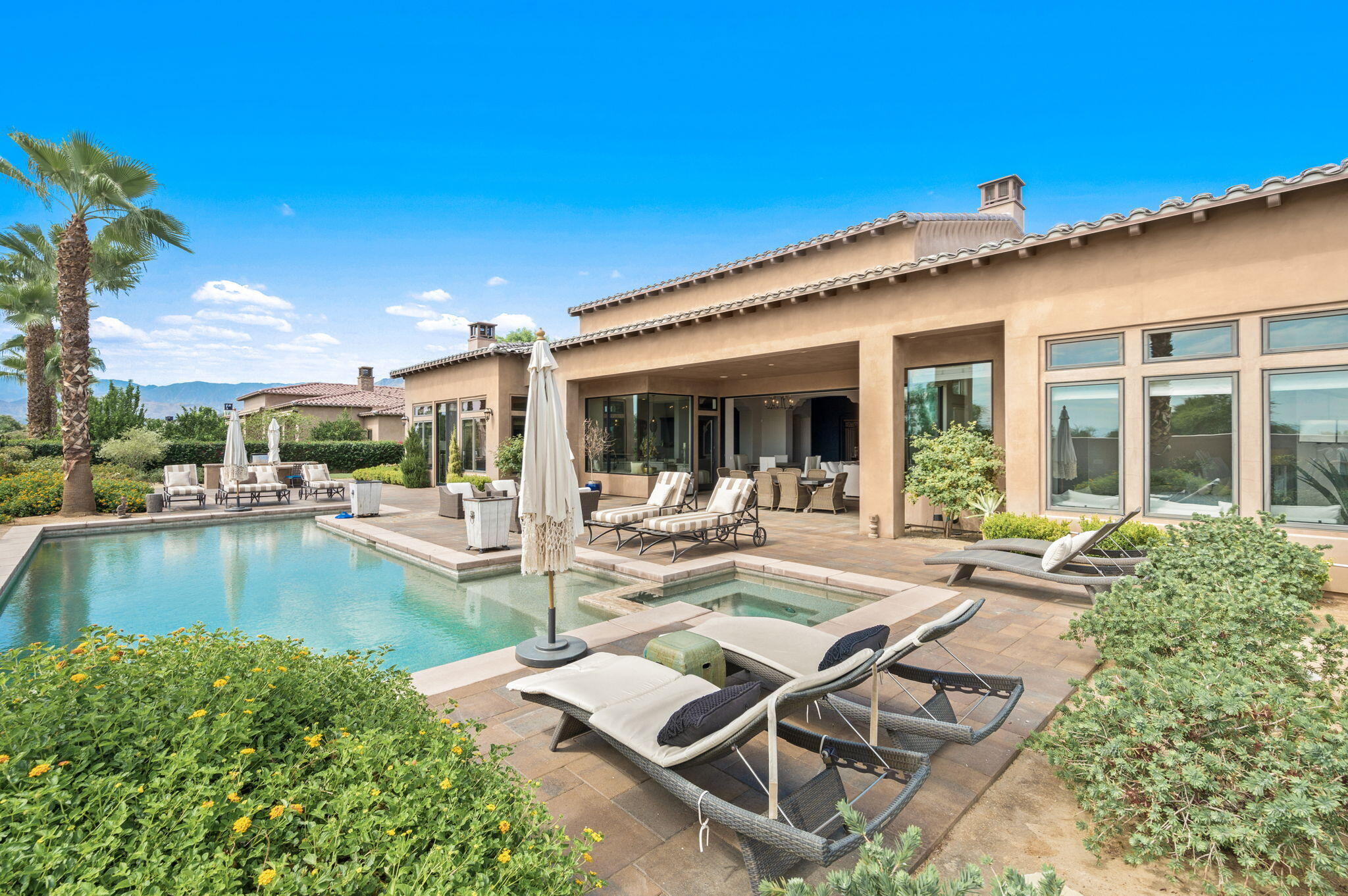 54360 Alysheba Drive La Quinta, CA 92253 - Photo 53 of 68 outdoor view of a house with swimming pool and sitting area