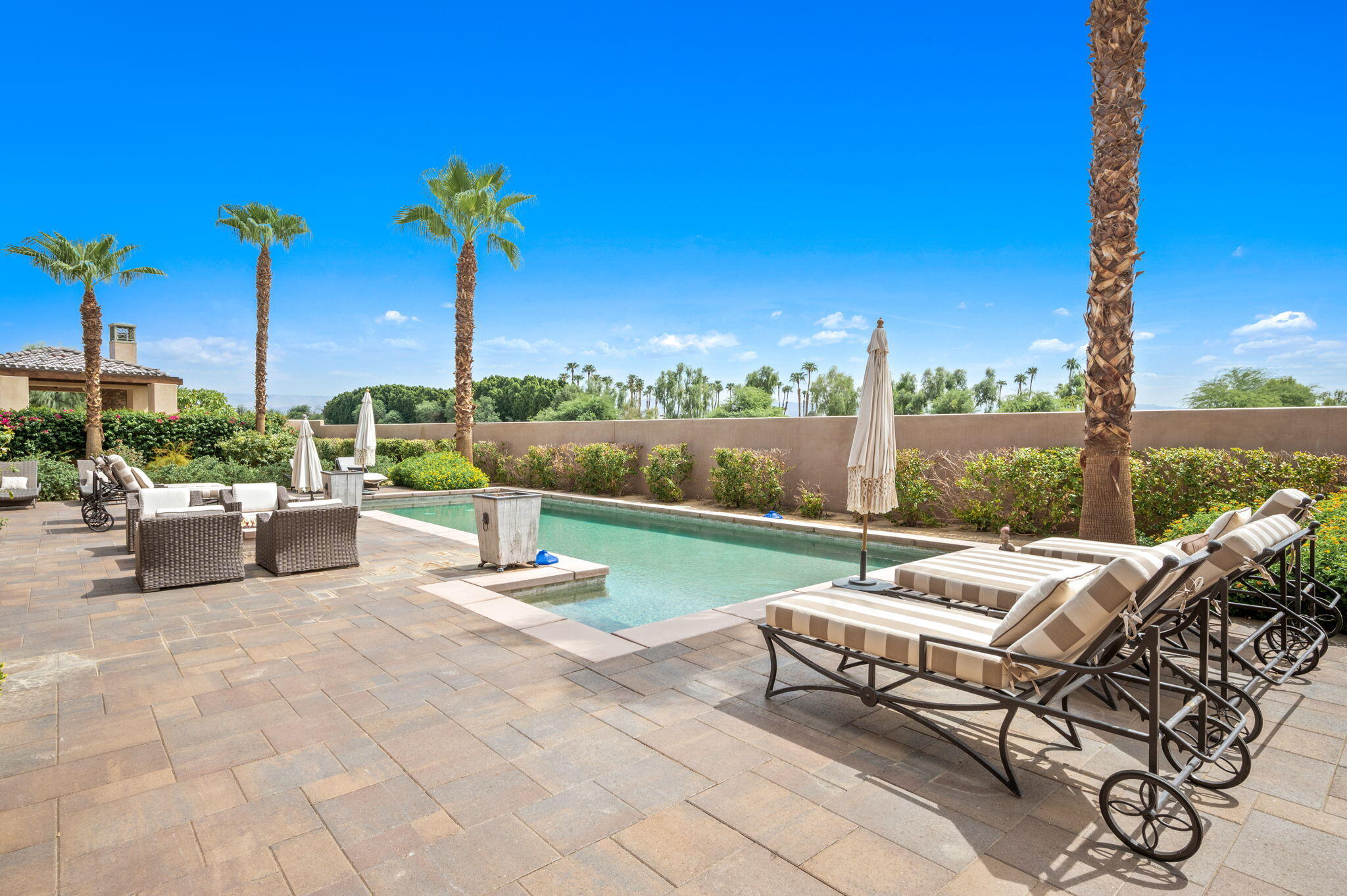 54360 Alysheba Drive La Quinta, CA 92253 - Photo 56 of 68 a view of a patio with chairs and table in patio