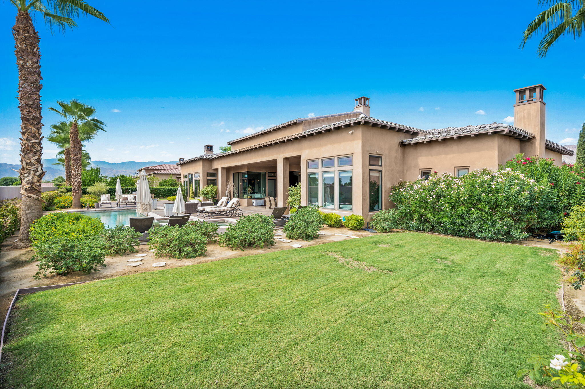 54360 Alysheba Drive La Quinta, CA 92253 - Photo 57 of 68 a front view of a house with a yard