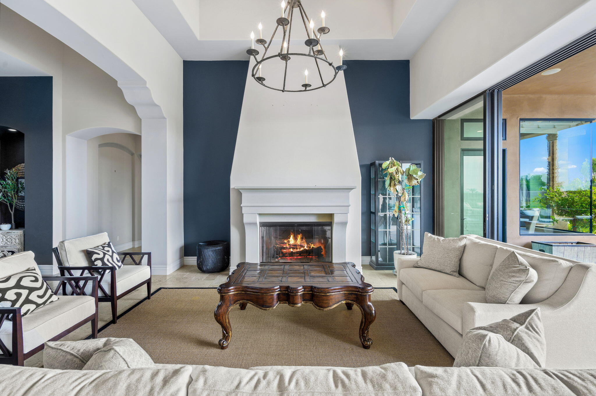 54360 Alysheba Drive La Quinta, CA 92253 - Photo 6 of 68 a living room with furniture a fireplace and window