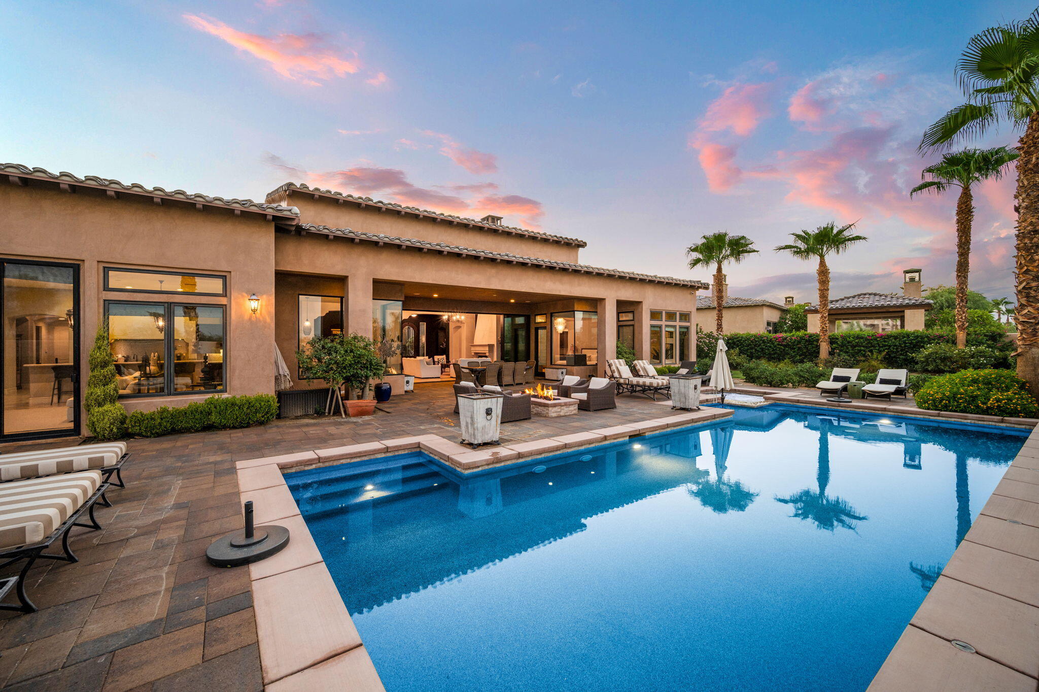 54360 Alysheba Drive La Quinta, CA 92253 - Photo 65 of 68 a view of a swimming pool with lounge chairs in patio