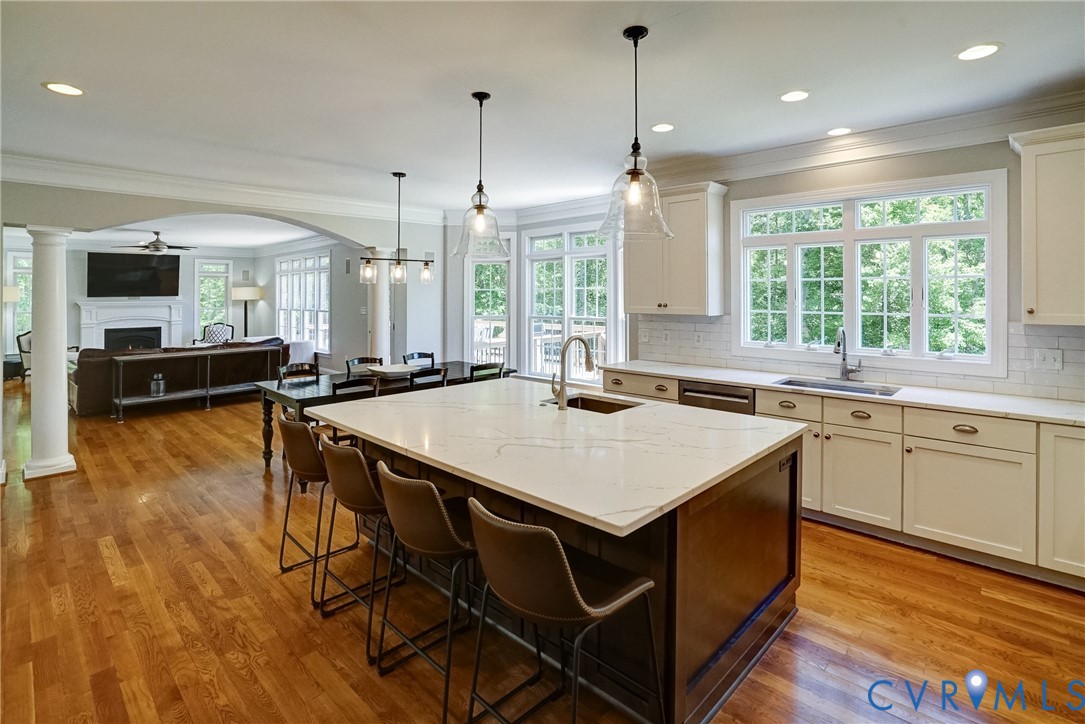 1295 Hermitage Road Manakin-Sabot, VA 23103 - Photo 28 of 55 a kitchen with a table chairs stove and wooden floor