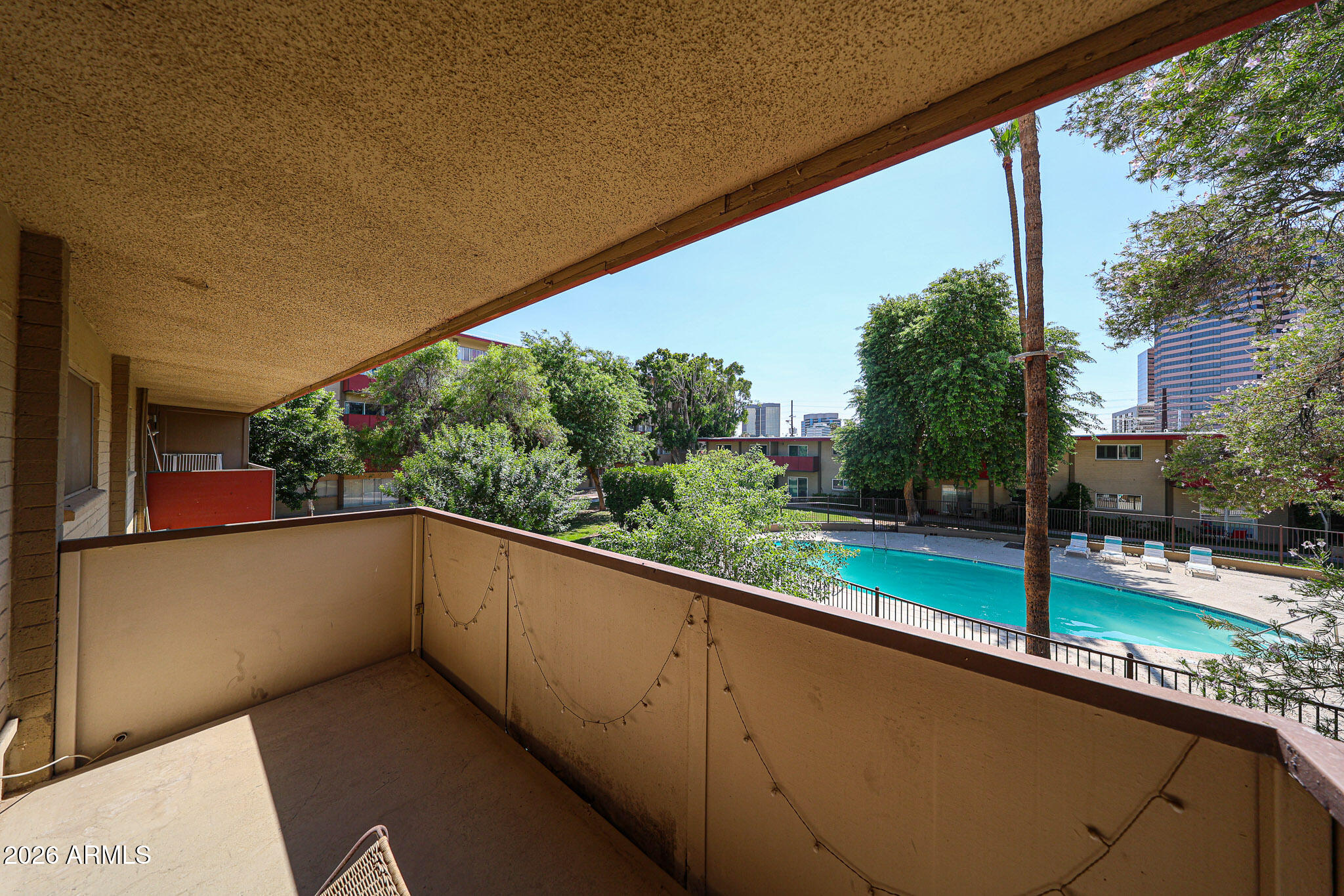 357 East Thomas Road, Unit A208 Phoenix, AZ 85012 - Photo 31 of 36 a view of a balcony with an outdoor space