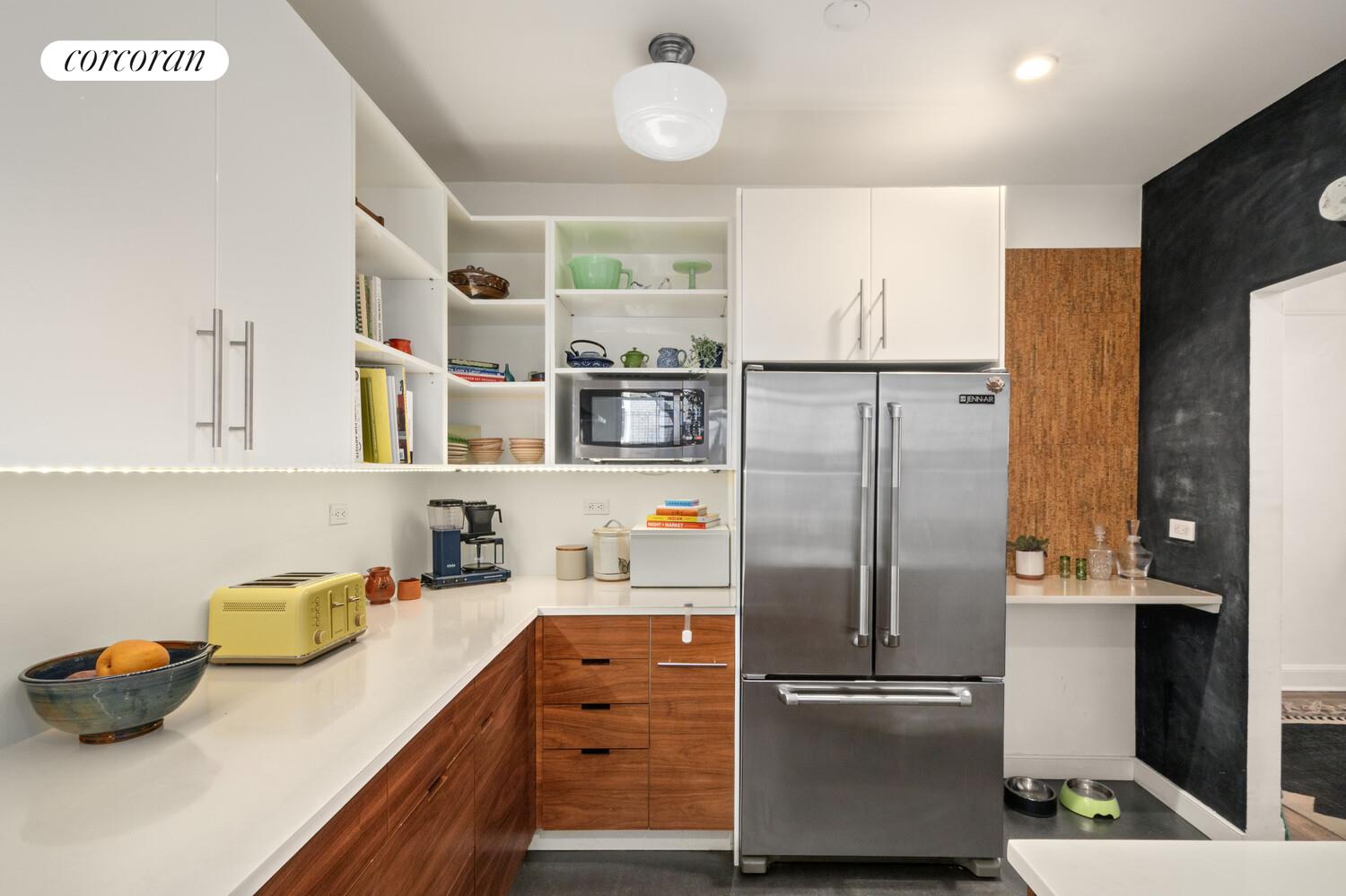 35-53 77th Street, Unit 3G Queens, NY 11372 - Photo 4 of 10 a kitchen with stainless steel appliances granite countertop a refrigerator and a sink
