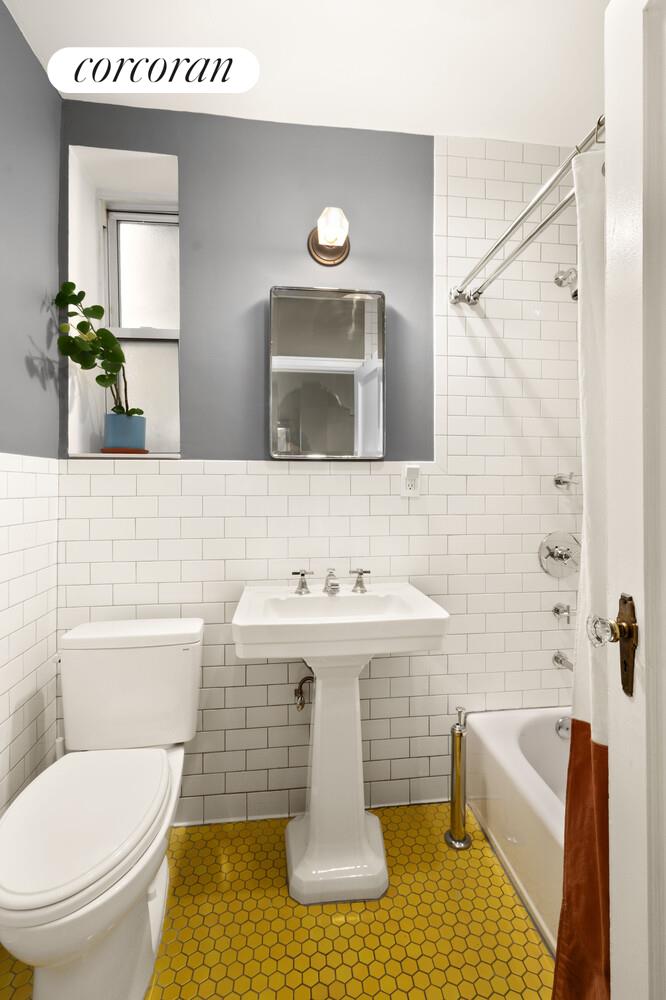 35-53 77th Street, Unit 3G Queens, NY 11372 - Photo 9 of 10 a bathroom with a sink toilet and shower