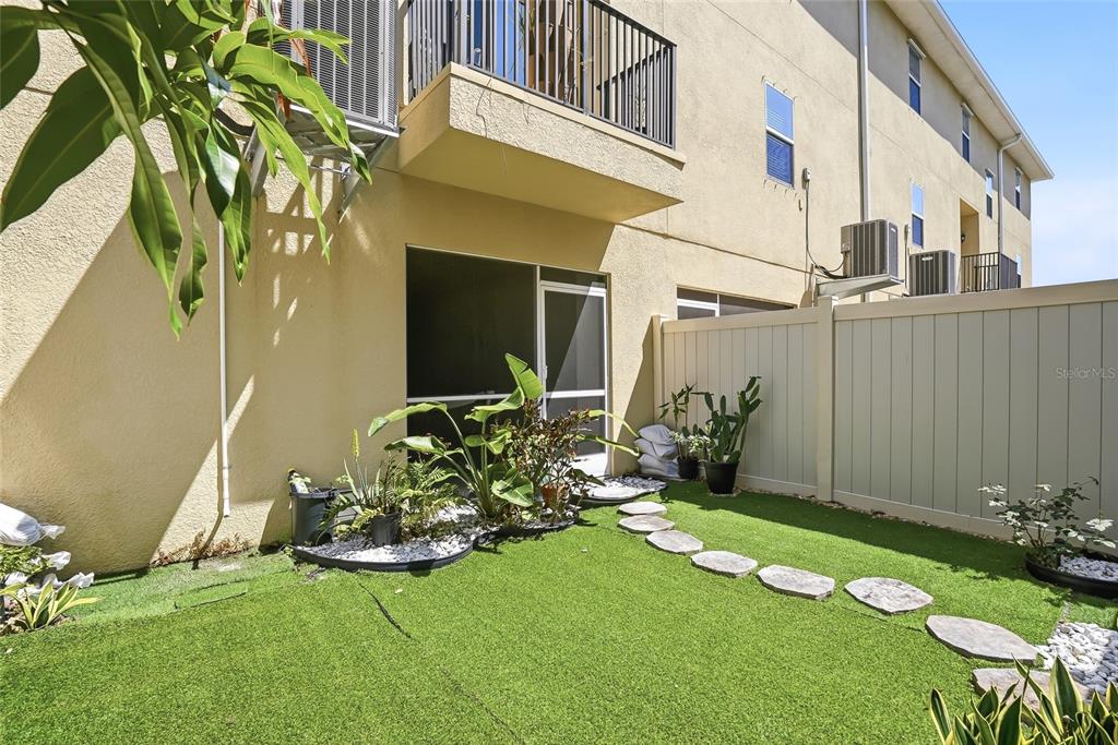 5523 Yellowfin Court New Port Richey, FL 34652 - Photo 11 of 58 a view of a chair and table in backyard