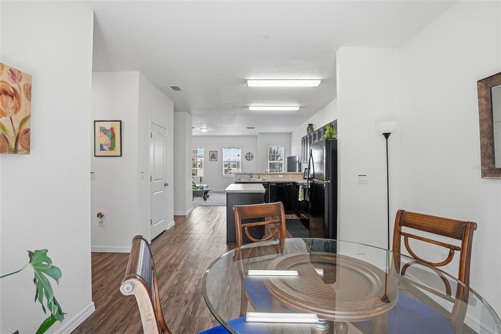 5523 Yellowfin Court New Port Richey, FL 34652 - Photo 16 of 58 a dining room with furniture and a kitchen view