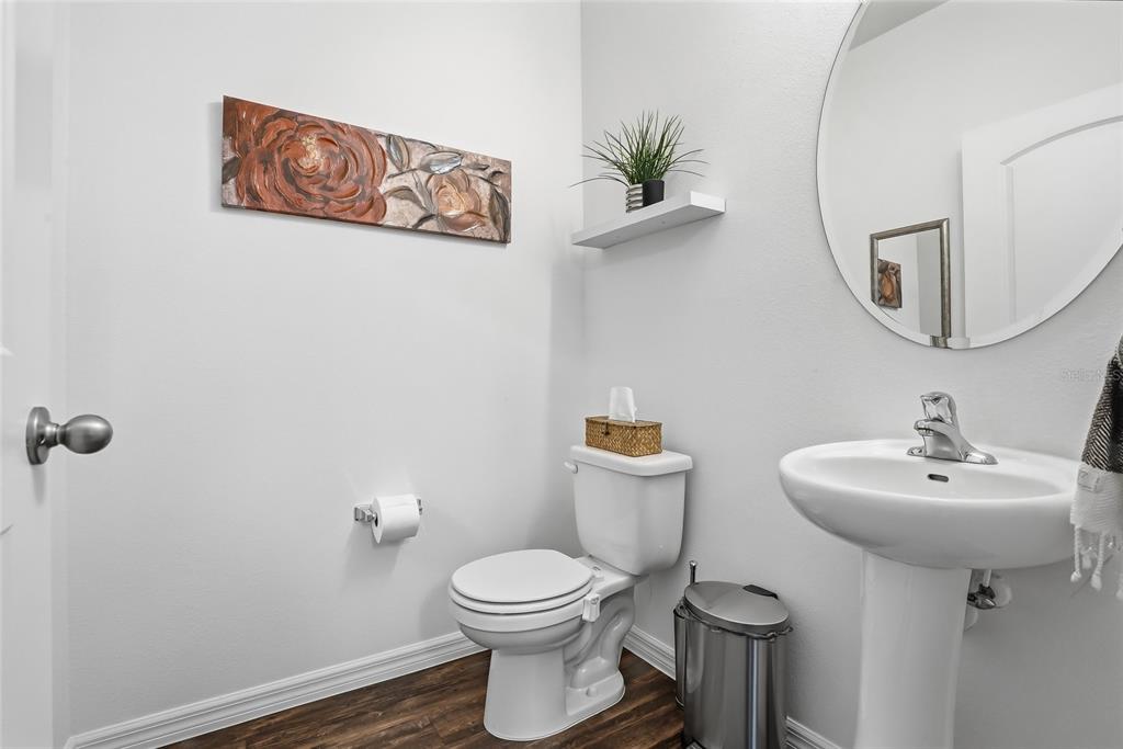 5523 Yellowfin Court New Port Richey, FL 34652 - Photo 23 of 58 a bathroom with a toilet sink and mirror