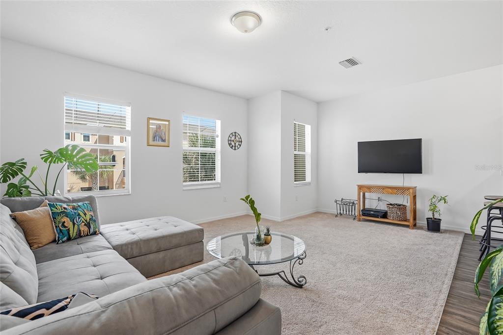 5523 Yellowfin Court New Port Richey, FL 34652 - Photo 27 of 58 a living room with furniture and a flat screen tv