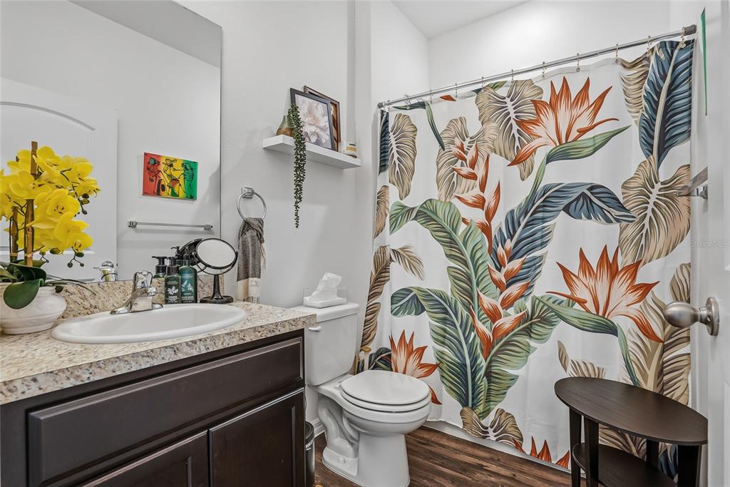 5523 Yellowfin Court New Port Richey, FL 34652 - Photo 33 of 58 a bathroom with a sink a toilet and a mirror