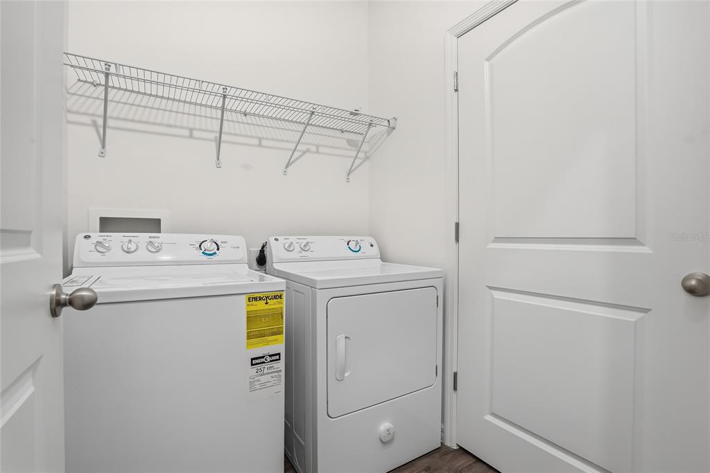 5523 Yellowfin Court New Port Richey, FL 34652 - Photo 35 of 58 a utility room with dryer and washer