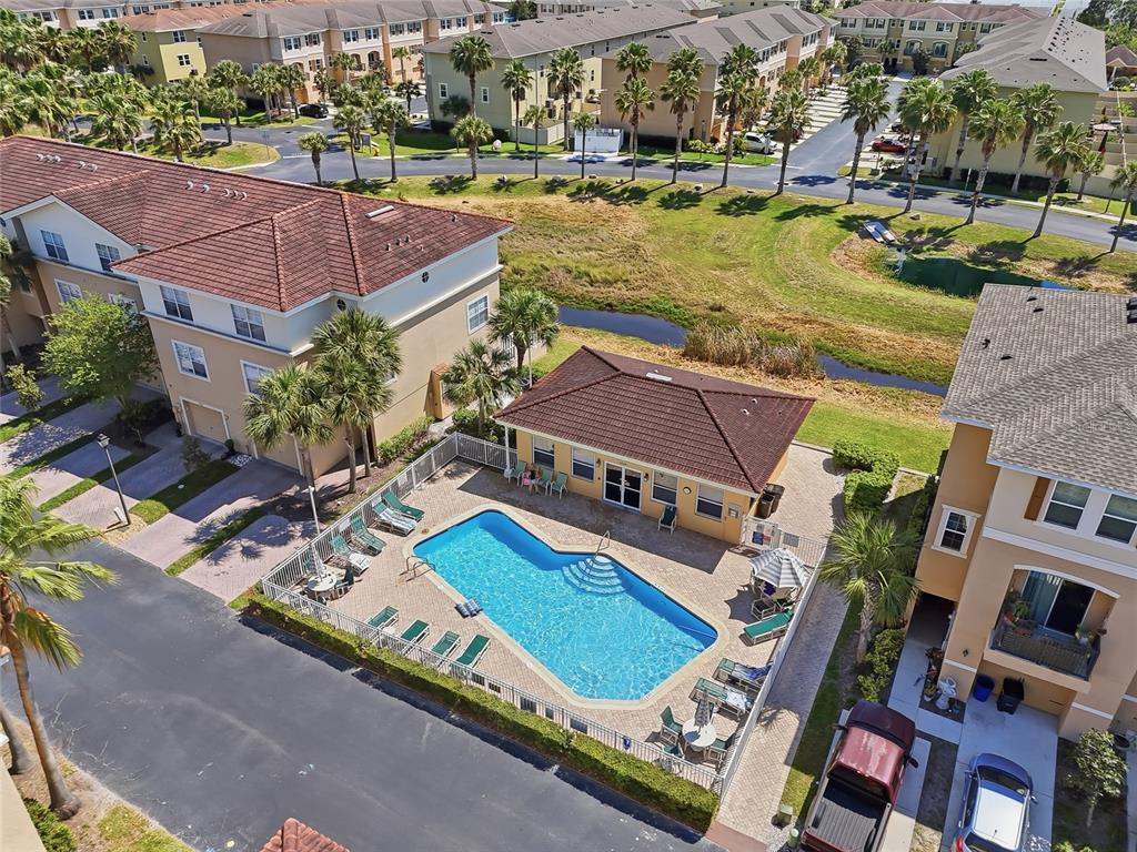 5523 Yellowfin Court New Port Richey, FL 34652 - Photo 45 of 58 an aerial view of residential houses with yard and swimming pool