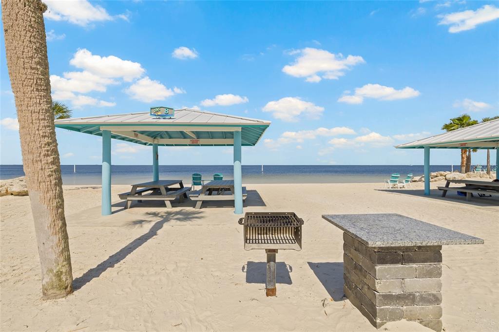5523 Yellowfin Court New Port Richey, FL 34652 - Photo 56 of 58 a view of a terrace with furniture and a garden