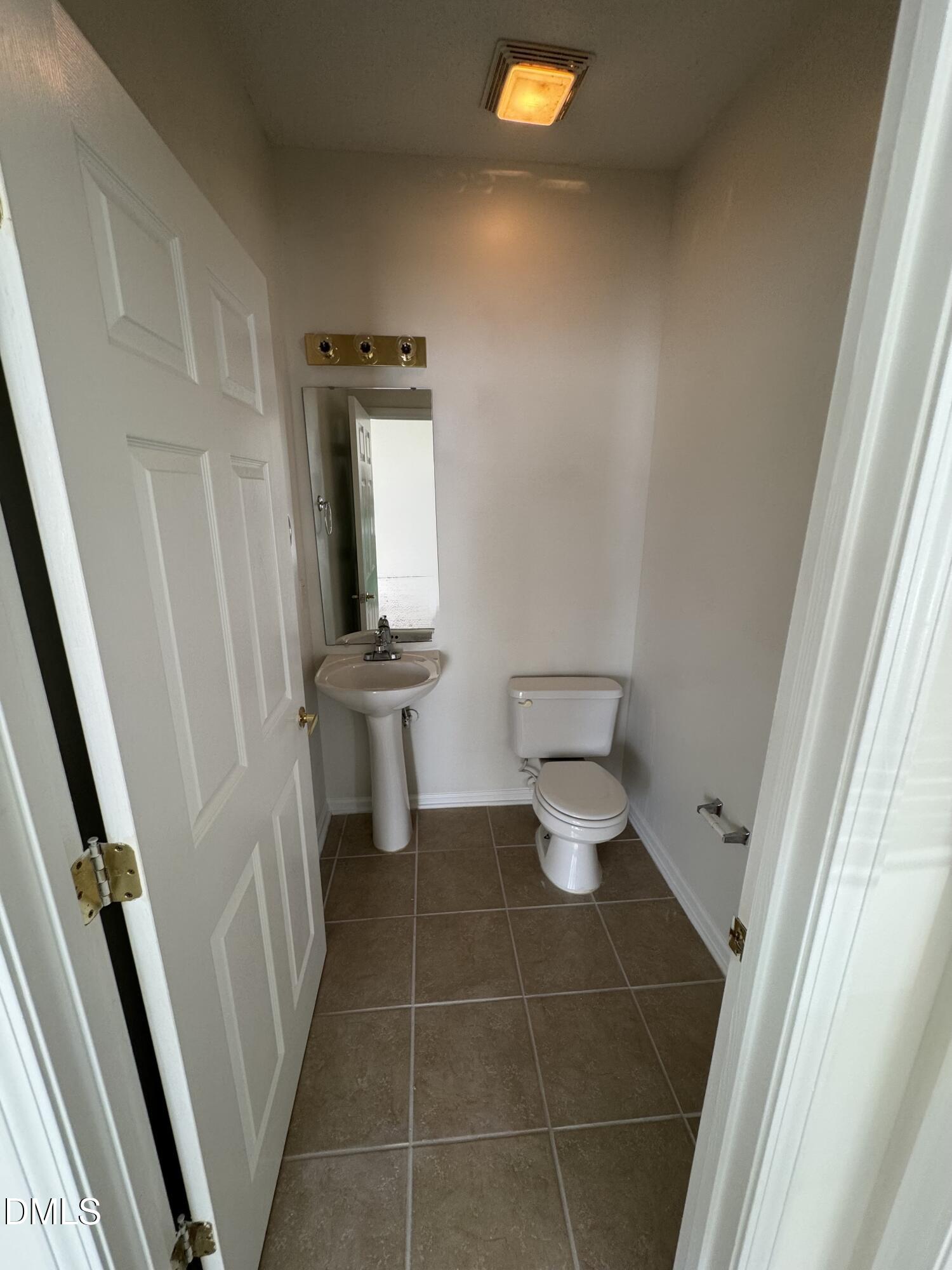 2501 Huntscroft Lane, Unit 201 Raleigh, NC 27617 - Photo 11 of 19 a bathroom with a sink and a mirror