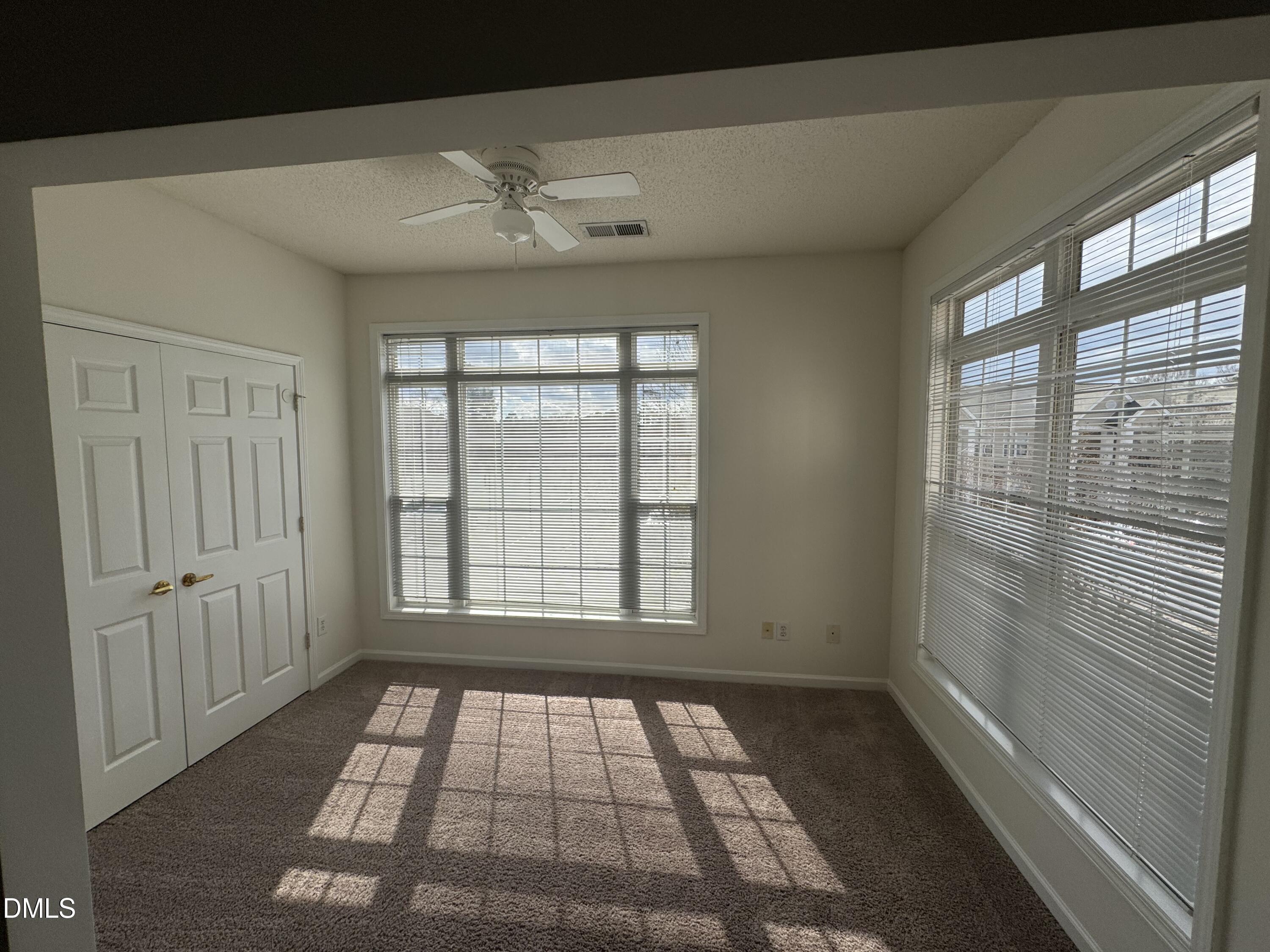 2501 Huntscroft Lane, Unit 201 Raleigh, NC 27617 - Photo 13 of 19 a view of an empty room with a window