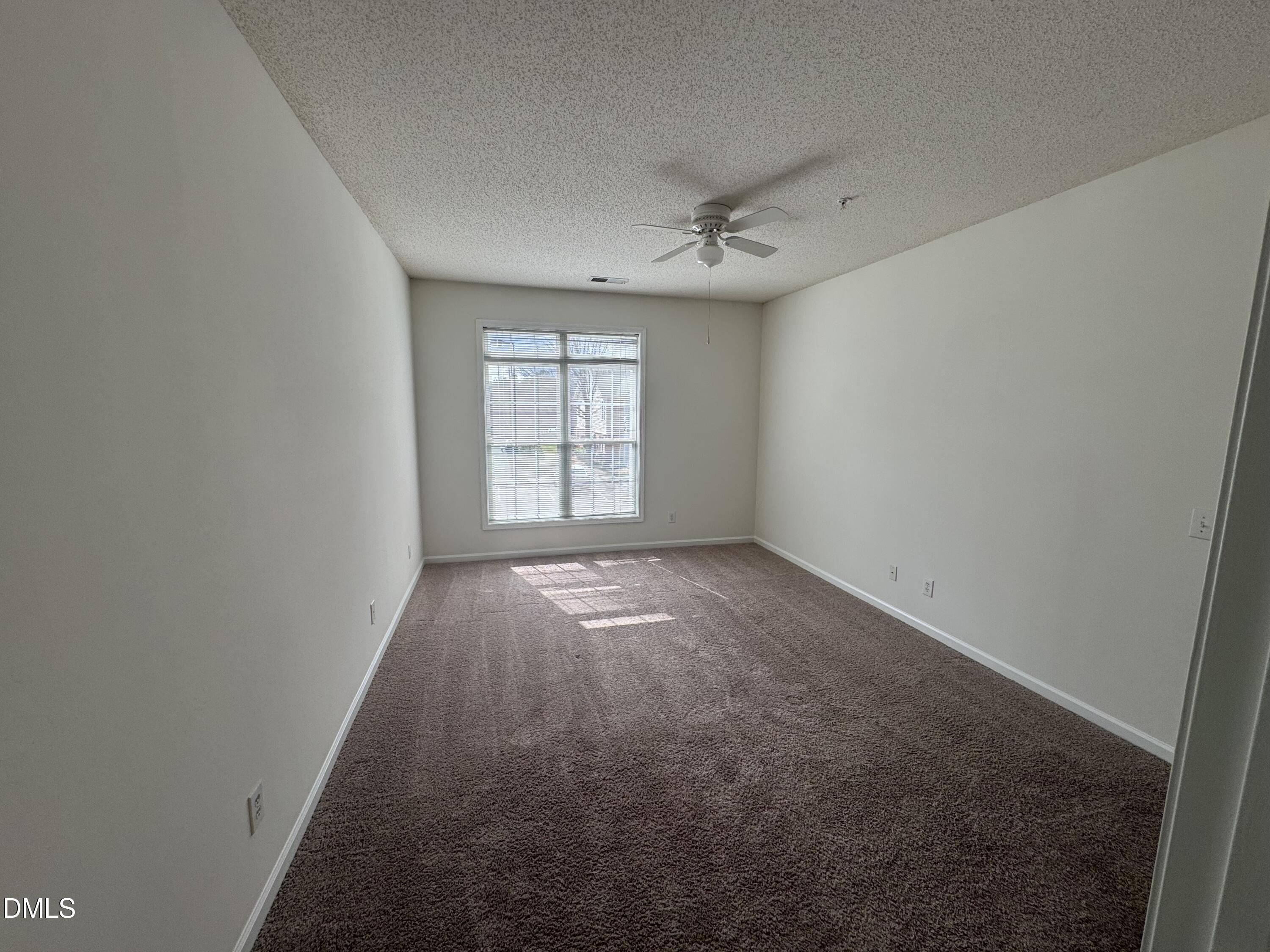 2501 Huntscroft Lane, Unit 201 Raleigh, NC 27617 - Photo 14 of 19 an empty room with windows