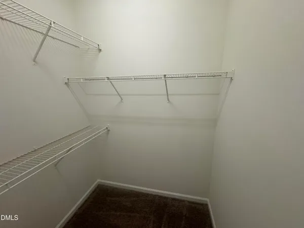 a view of small space with racks on the wall