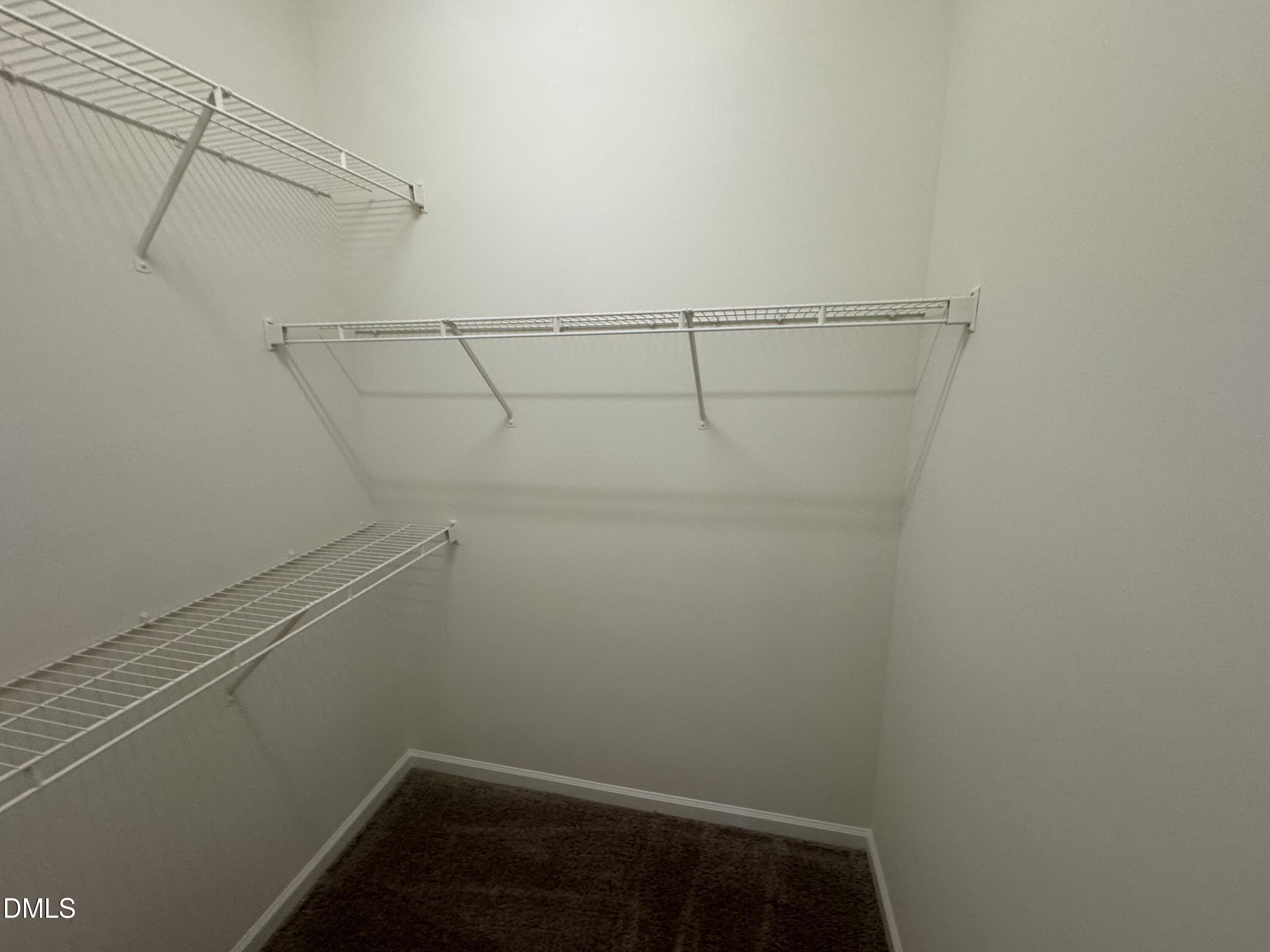 2501 Huntscroft Lane, Unit 201 Raleigh, NC 27617 - Photo 15 of 19 a view of small space with racks on the wall