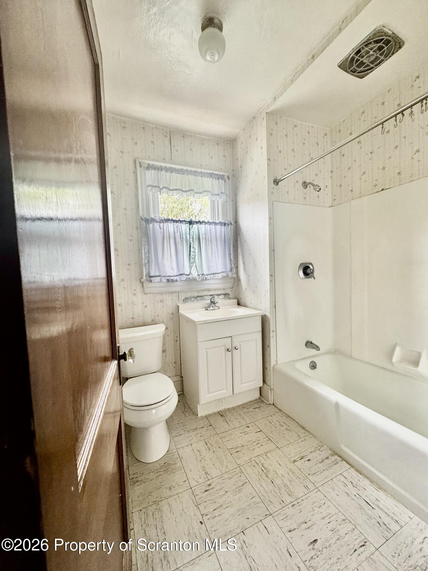 2120 Myrtle Street Scranton, PA 18510 - Photo 33 of 42 a bathroom with a sink a toilet and shower