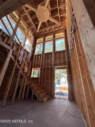 a view of an outdoor space with wooden floor and a ceiling fan