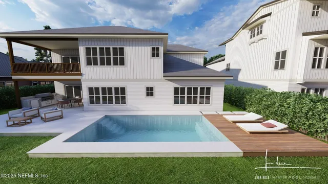 a view of a house with pool and chairs