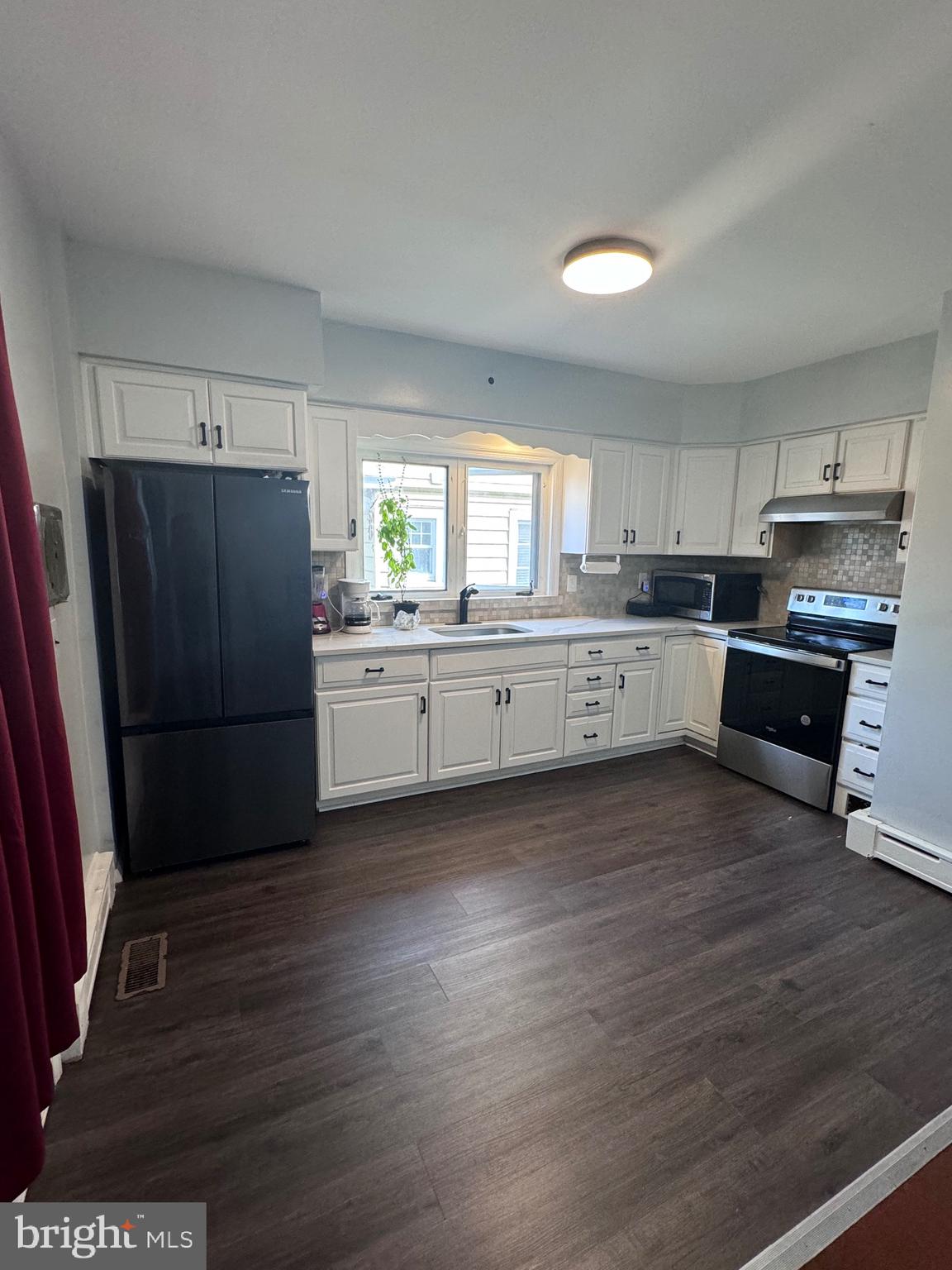 3250 Broad Hamilton, NJ 08610 - Photo 27 of 43 a kitchen with granite countertop a refrigerator and a stove top oven