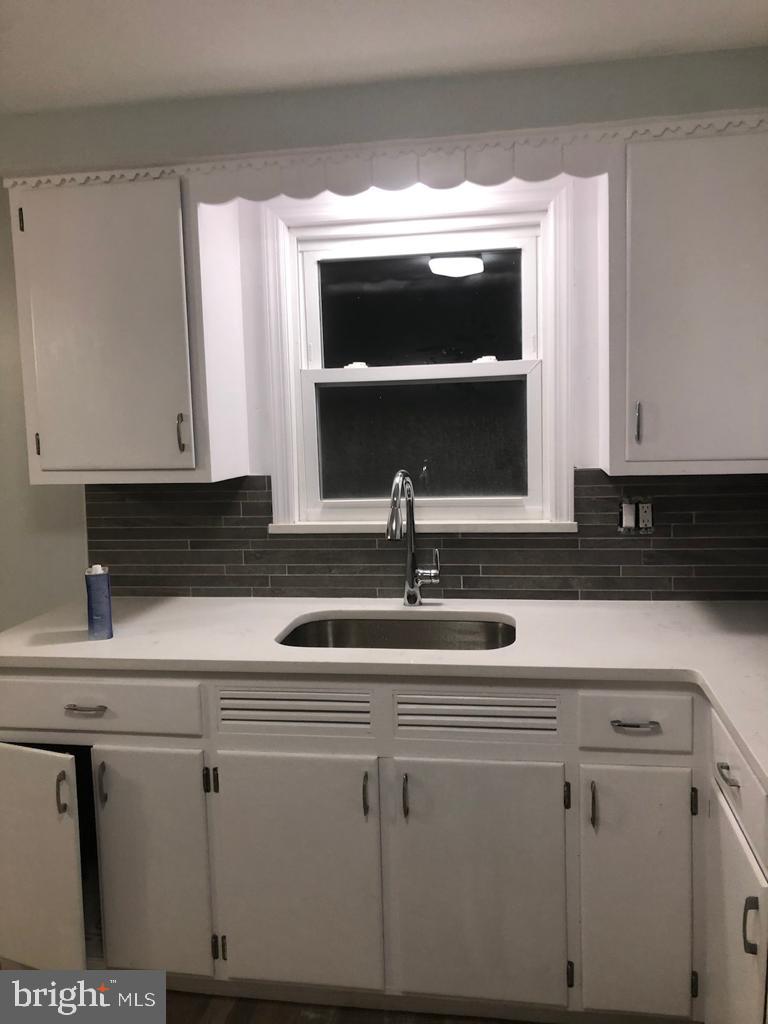3250 Broad Hamilton, NJ 08610 - Photo 7 of 43 a kitchen with white cabinets and sink