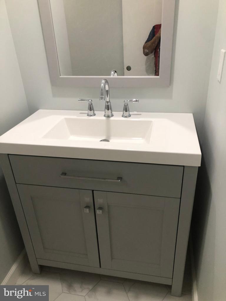 3250 Broad Hamilton, NJ 08610 - Photo 10 of 43 a bathroom with a sink and a mirror