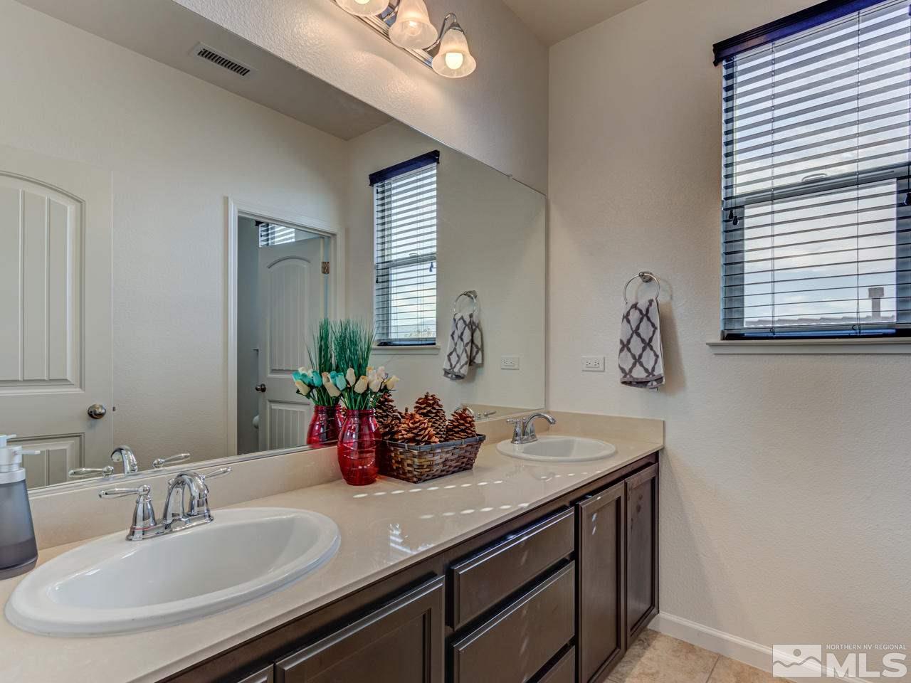 2075 Tawleed Road Reno, NV 89521 - Photo 19 of 24 a bathroom with a sink and a mirror