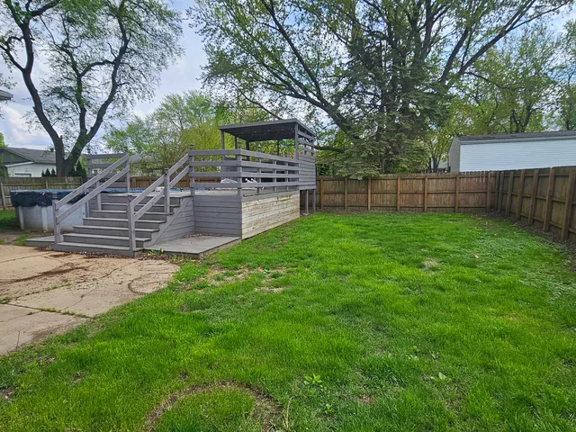 a view of a backyard with sitting area