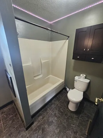 a bathroom with a sink a mirror and a toilet