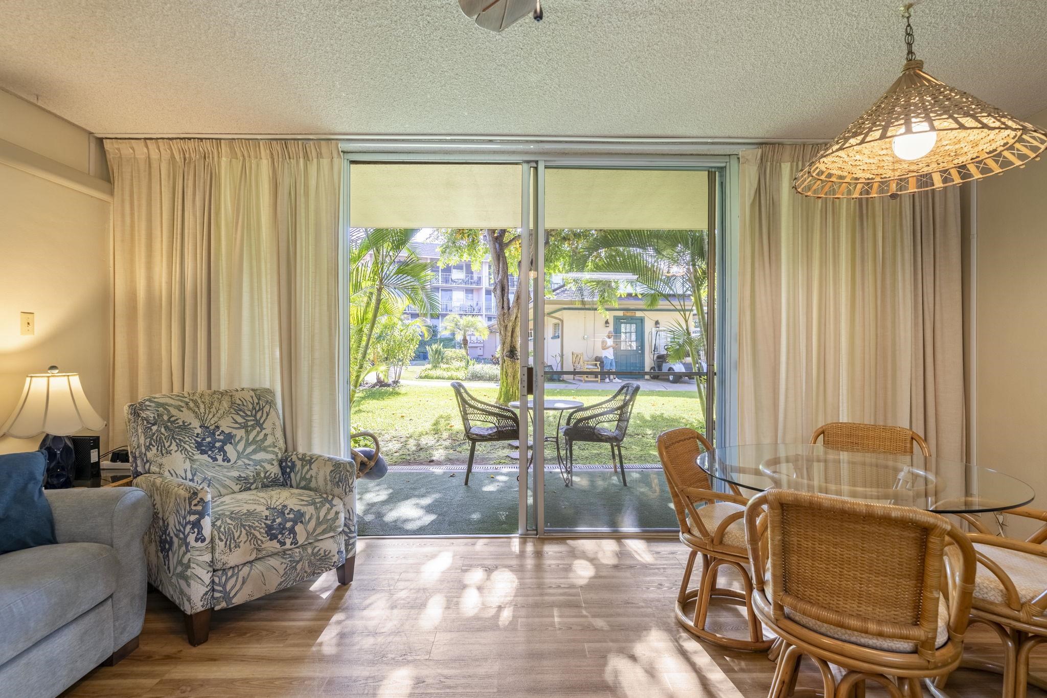 2495 South Kihei Road, Unit 120 Kihei, HI 96753 - Photo 1 of 40 a living room with furniture and a large window