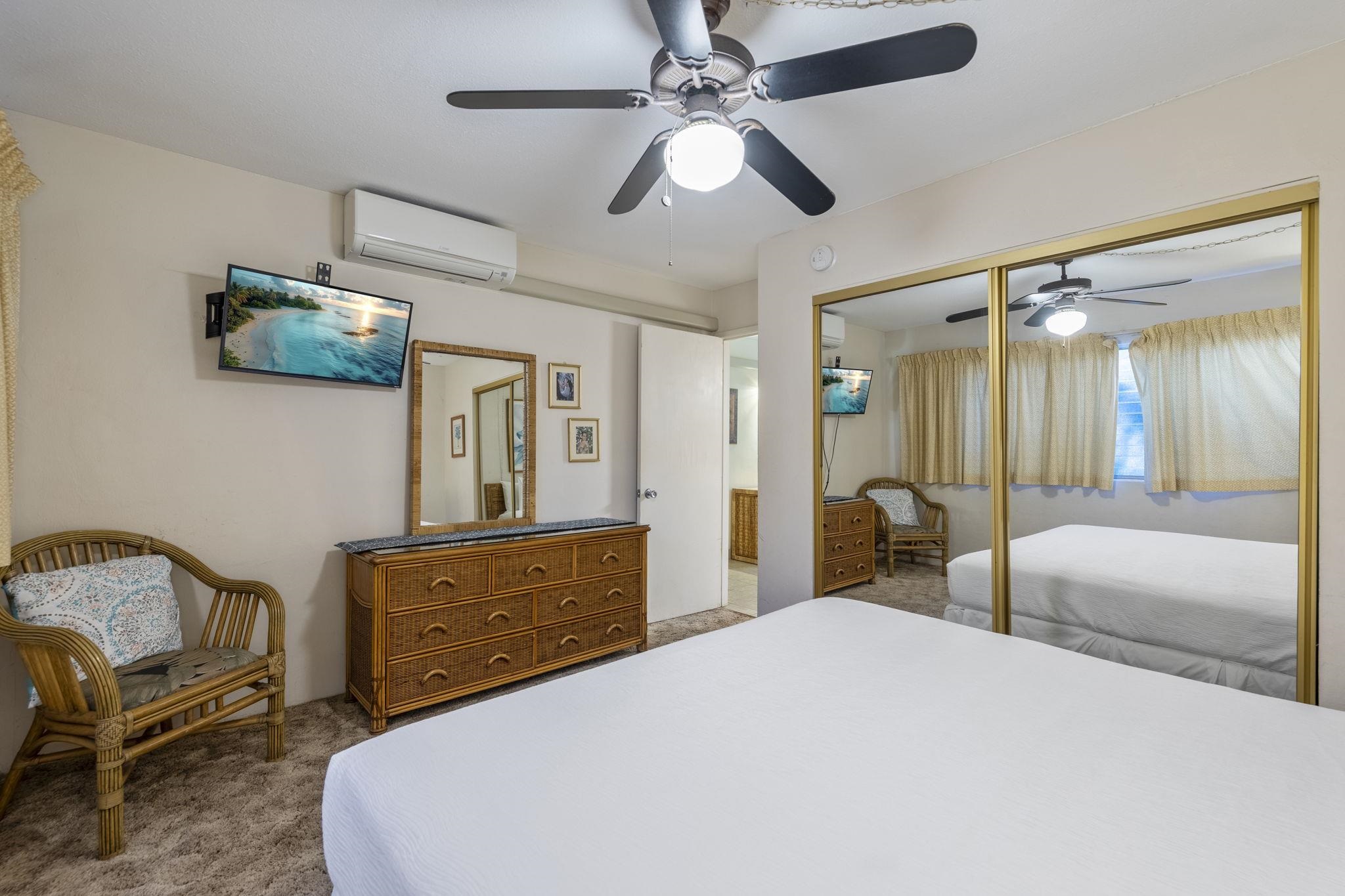 2495 South Kihei Road, Unit 120 Kihei, HI 96753 - Photo 16 of 40 a bedroom with a bed a couch and dresser