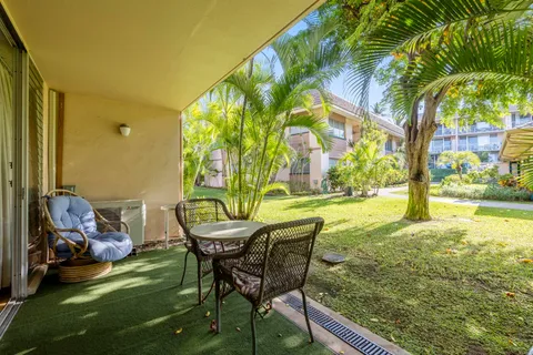 a view of an outdoor sitting area in a yard