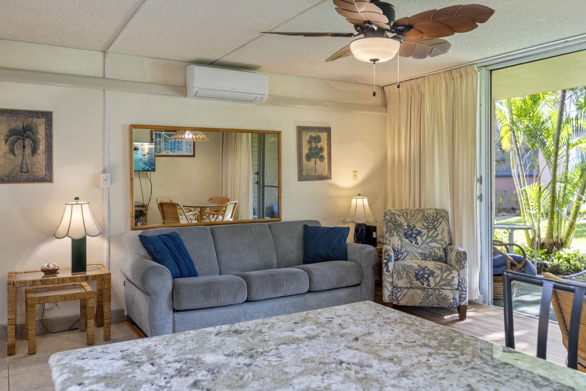 2495 South Kihei Road, Unit 120 Kihei, HI 96753 - Photo 8 of 40 a living room with furniture and a large window