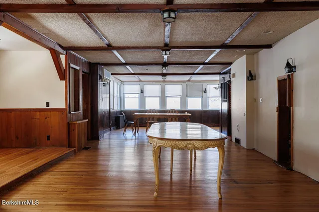 a view of room with wooden floor
