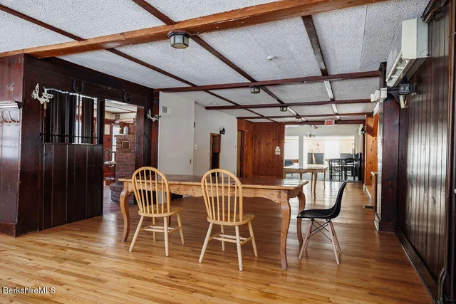 a view of dining room with furniture and wooden floor