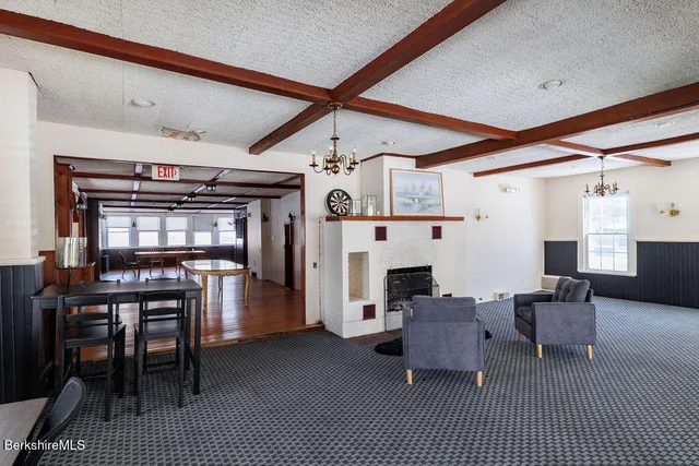 a front view of a residential apartment building with a yard