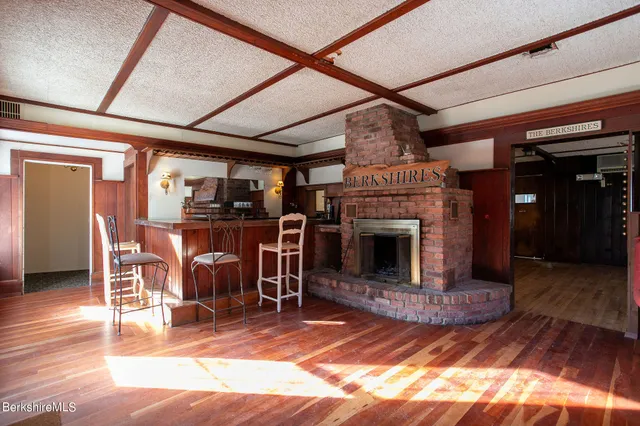 a front view of a house with a garden and plants